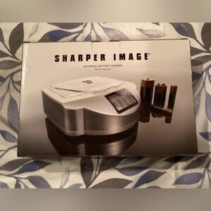 NIB Sharper Image Universal Battery Charger